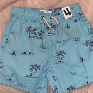 Little boys size 4 golly shirt , skeletons , surf